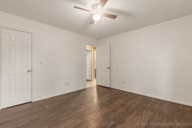 8424 Harp Blvd, Broken Arrow, OK 74014 - spare room featuring dark wood-type flooring, a ceiling fan, a textured ceiling, and baseboards