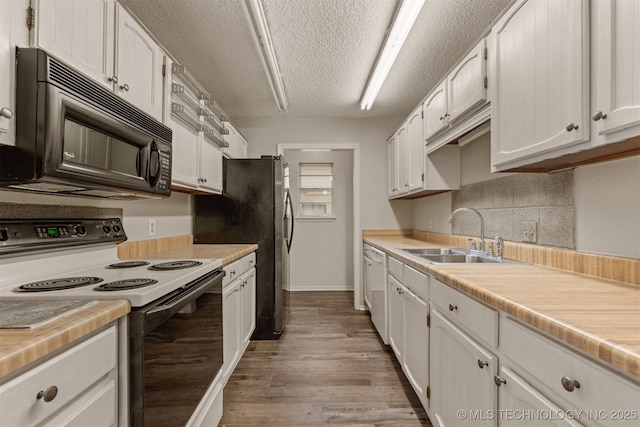4012 S Cedar Ave, Broken Arrow, OK 74011 - kitchen featuring range with electric cooktop, black microwave, a sink, dishwasher, and light wood finished floors