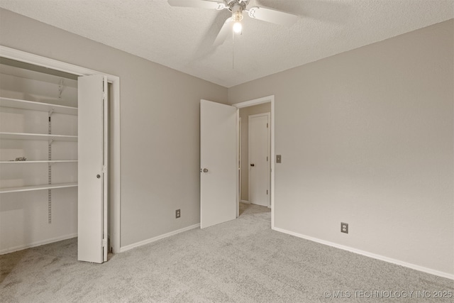 4012 S Cedar Ave, Broken Arrow, OK 74011 - unfurnished bedroom with carpet, a closet, a ceiling fan, baseboards, and a textured ceiling