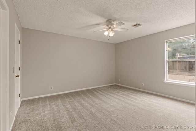 4012 S Cedar Ave, Broken Arrow, OK 74011 - spare room featuring ceiling fan, carpet, a textured ceiling, and baseboards