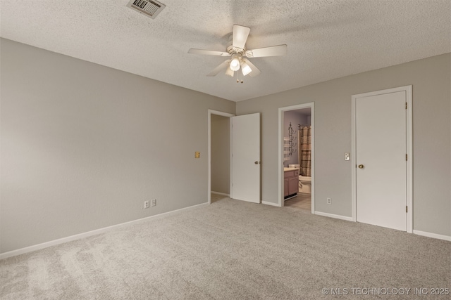 4012 S Cedar Ave, Broken Arrow, OK 74011 - unfurnished bedroom with light carpet, baseboards, a textured ceiling, ensuite bath, and ceiling fan