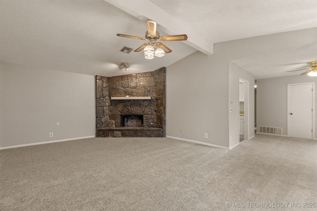 4012 S Cedar Ave, Broken Arrow, OK 74011 - unfurnished living room with ceiling fan, carpet, a stone fireplace, a textured ceiling, and baseboards