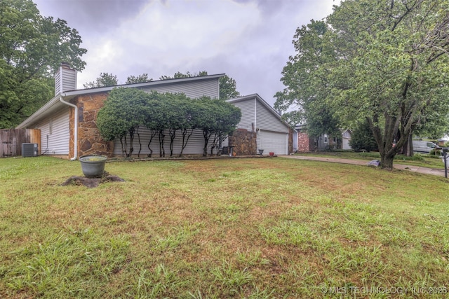 4012 S Cedar Ave, Broken Arrow, OK 74011 - mid-century inspired home featuring central air condition unit, a chimney, stone siding, and driveway