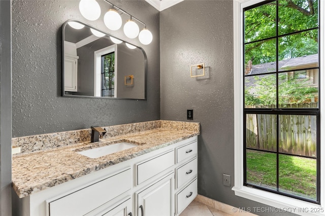 7802 S Joplin Ave, Tulsa, OK 74136 - bathroom featuring a textured wall and vanity