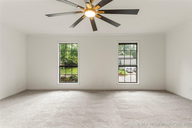 7802 S Joplin Ave, Tulsa, OK 74136 - empty room with crown molding, plenty of natural light, carpet, a ceiling fan, and baseboards