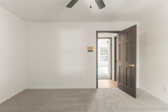7802 S Joplin Ave, Tulsa, OK 74136 - empty room with light colored carpet, a ceiling fan, and baseboards