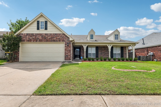 12326 S Cedar Ave, Jenks, OK 74037 - view of front of property featuring brick siding, a front lawn, concrete driveway, and an attached garage