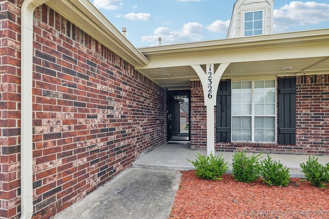 12326 S Cedar Ave, Jenks, OK 74037 - view of exterior entry with brick siding and covered porch