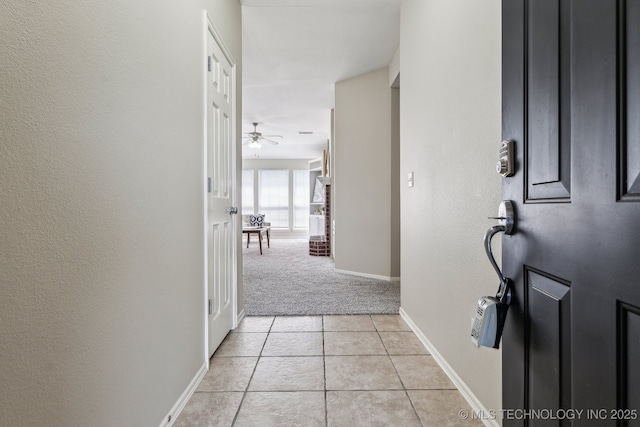 12326 S Cedar Ave, Jenks, OK 74037 - hallway featuring light colored carpet, light tile patterned floors, and baseboards