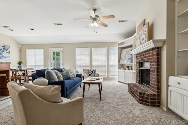 12326 S Cedar Ave, Jenks, OK 74037 - carpeted living room featuring ceiling fan, a fireplace, and vaulted ceiling