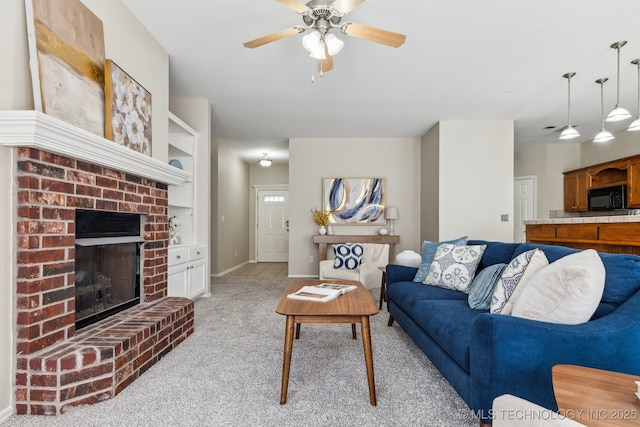 12326 S Cedar Ave, Jenks, OK 74037 - living area featuring light colored carpet, a brick fireplace, a ceiling fan, and baseboards