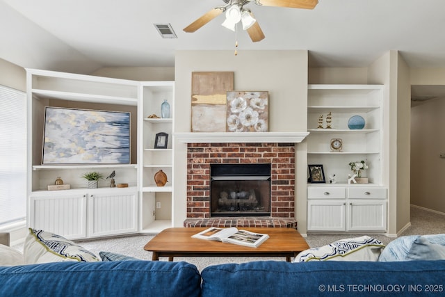 12326 S Cedar Ave, Jenks, OK 74037 - living room with carpet flooring, ceiling fan, a fireplace, built in shelves, and vaulted ceiling