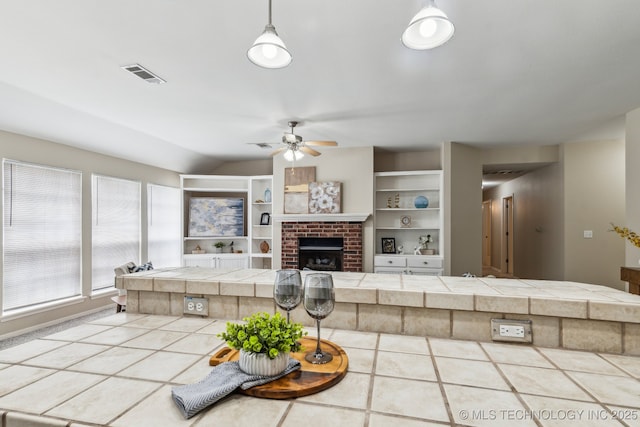 12326 S Cedar Ave, Jenks, OK 74037 - tiled living area featuring a ceiling fan, a fireplace, and lofted ceiling