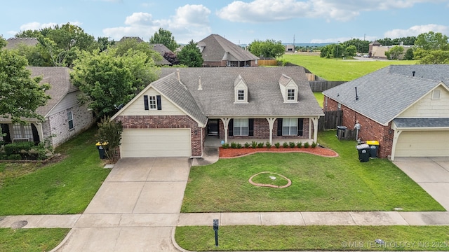 12326 S Cedar Ave, Jenks, OK 74037 - view of front facade featuring brick siding, an attached garage, concrete driveway, and a residential view