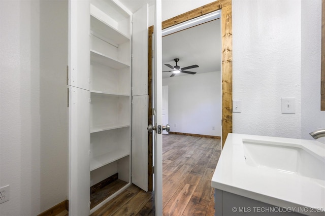 984 Ridgepoint, Fort Towson, OK 74735 - bathroom with wood finished floors, a ceiling fan, and vanity