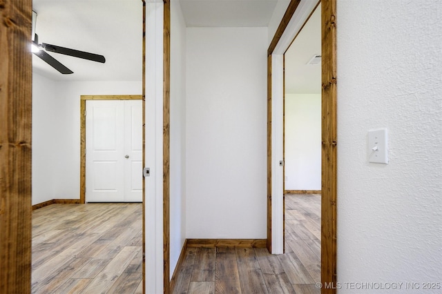 984 Ridgepoint, Fort Towson, OK 74735 - corridor with wood finished floors and baseboards