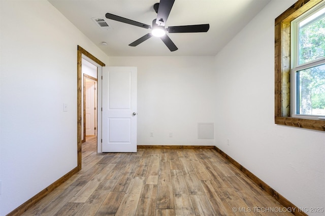 984 Ridgepoint, Fort Towson, OK 74735 - empty room featuring wood finished floors, plenty of natural light, and baseboards