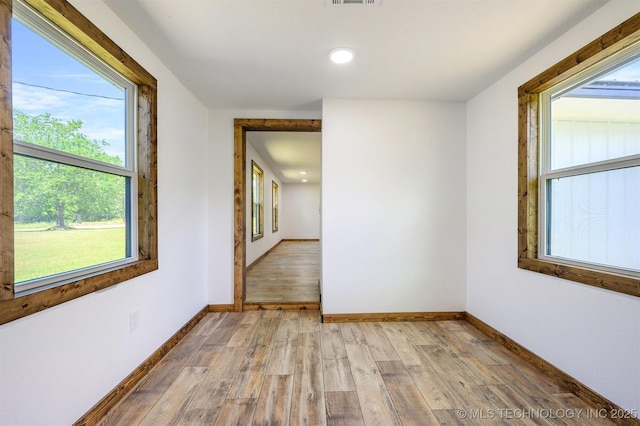 984 Ridgepoint, Fort Towson, OK 74735 - unfurnished room with light wood-style flooring, plenty of natural light, baseboards, and recessed lighting