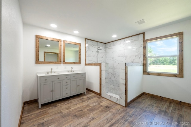 984 Ridgepoint, Fort Towson, OK 74735 - bathroom featuring double vanity, walk in shower, wood finished floors, recessed lighting, and baseboards