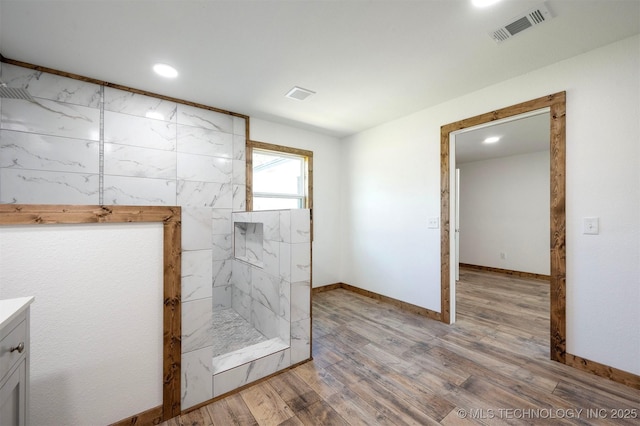 984 Ridgepoint, Fort Towson, OK 74735 - bathroom with a marble finish shower, vanity, wood finished floors, recessed lighting, and baseboards