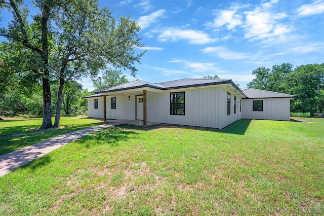 984 Ridgepoint, Fort Towson, OK 74735 - modern farmhouse featuring metal roof, a front yard, and board and batten siding
