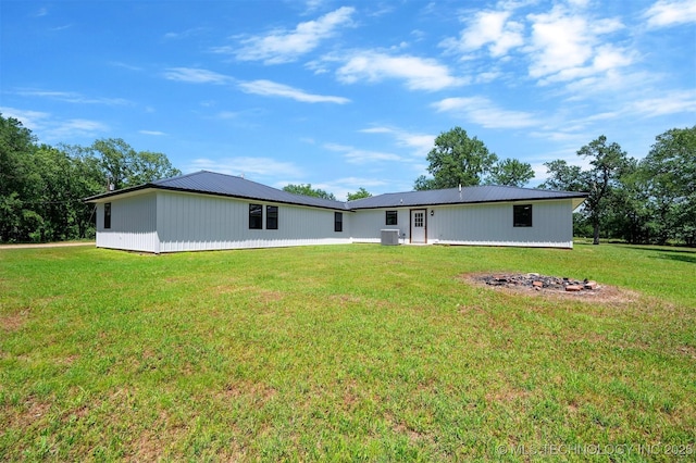 984 Ridgepoint, Fort Towson, OK 74735 - back of house with a lawn, metal roof, and central air condition unit