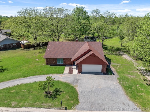 1510 Bowden Pl, Fort Gibson, OK 74434 - view of front of property with brick siding, asphalt driveway, a garage, and a front yard