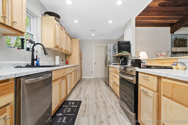 1510 Bowden Pl, Fort Gibson, OK 74434 - kitchen featuring appliances with stainless steel finishes, light brown cabinets, a sink, light wood-style floors, and recessed lighting