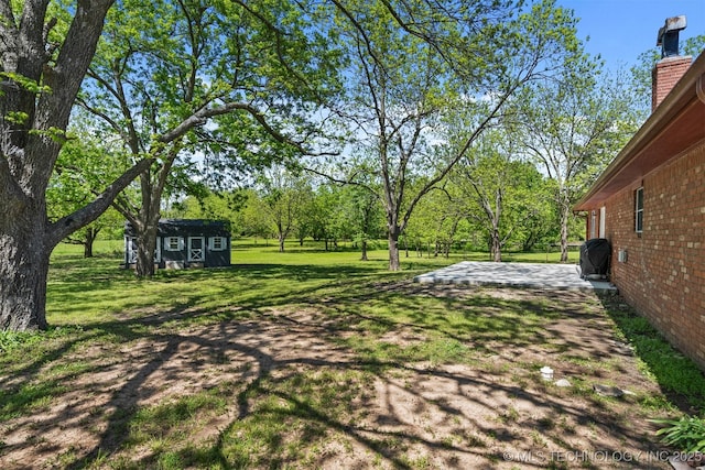 1510 Bowden Pl, Fort Gibson, OK 74434 - view of grassy yard with an outdoor structure