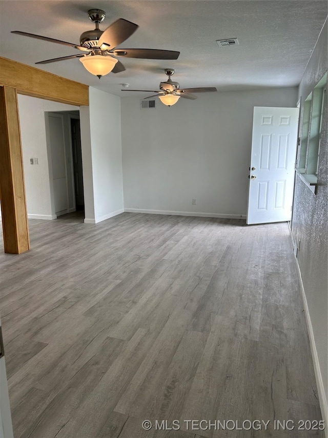 4613 N Main St E, Tulsa, OK 74115 - empty room with ceiling fan, wood finished floors, and baseboards