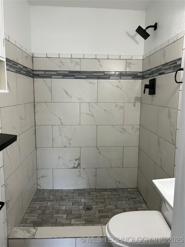 4613 N Main St E, Tulsa, OK 74115 - full bathroom featuring a tile shower and toilet