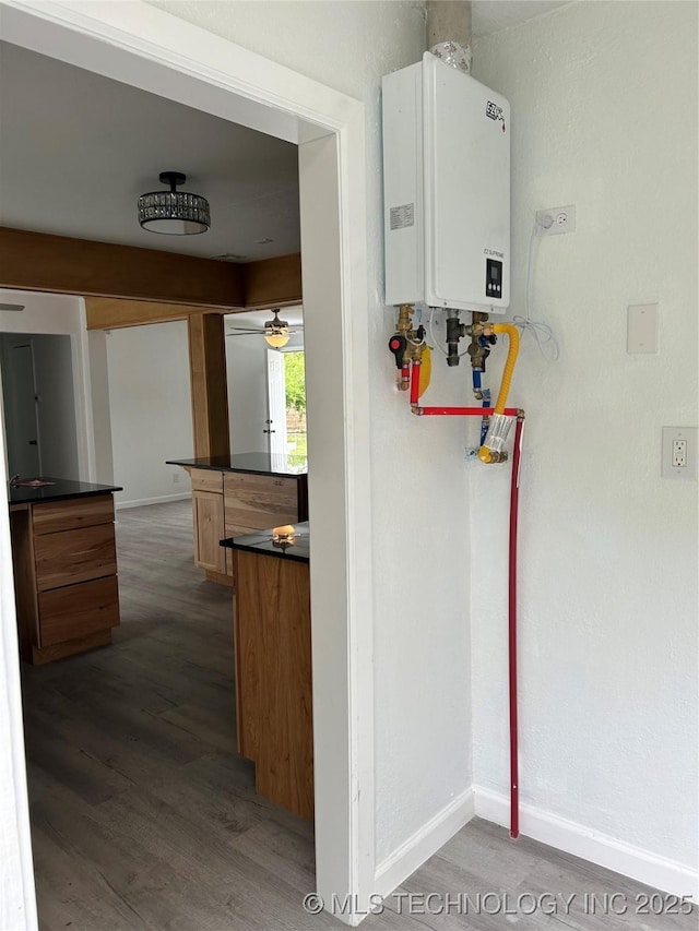 4613 N Main St E, Tulsa, OK 74115 - utility room featuring tankless water heater