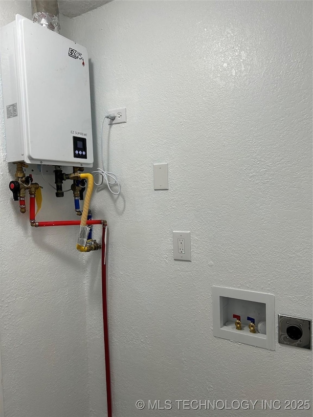 4613 N Main St E, Tulsa, OK 74115 - laundry area featuring tankless water heater and hookup for a washing machine