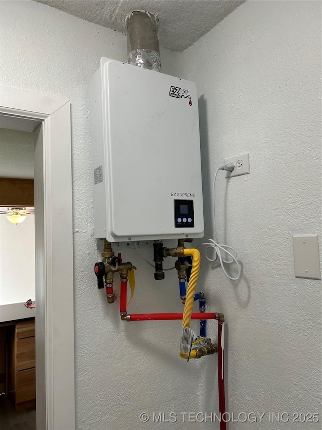 4613 N Main St E, Tulsa, OK 74115 - utility room with tankless water heater