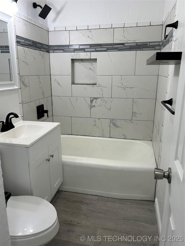 4613 N Main St E, Tulsa, OK 74115 - full bath with vanity, wood finished floors, shower / washtub combination, and toilet
