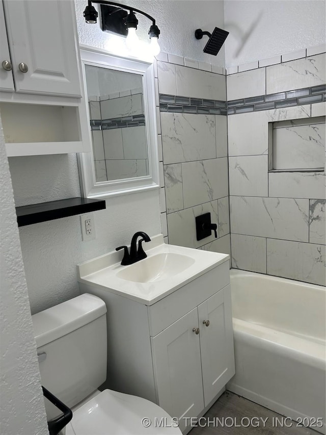 4613 N Main St E, Tulsa, OK 74115 - bathroom with a textured wall, toilet, vanity, and shower / bath combination
