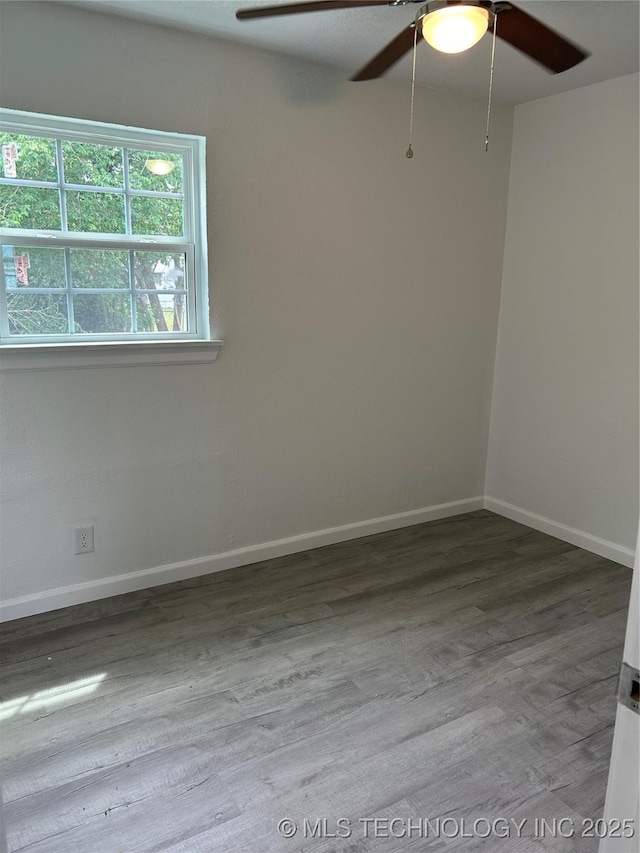4613 N Main St E, Tulsa, OK 74115 - empty room with a ceiling fan, wood finished floors, and baseboards