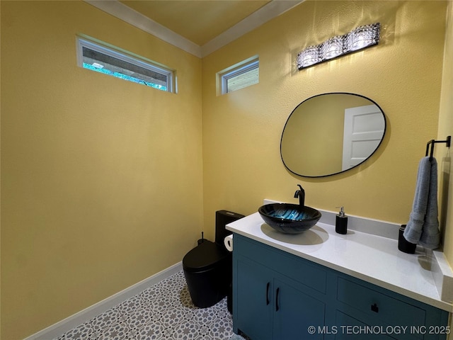 659 Sleepy Hollow Ln, Cleveland, OK 74020 - bathroom with vanity, toilet, tile patterned floors, and baseboards