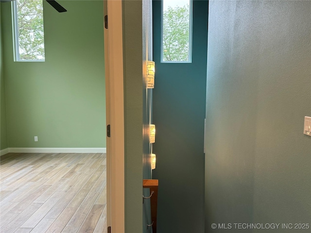 659 Sleepy Hollow Ln, Cleveland, OK 74020 - spare room featuring wood finished floors, plenty of natural light, baseboards, and ceiling fan