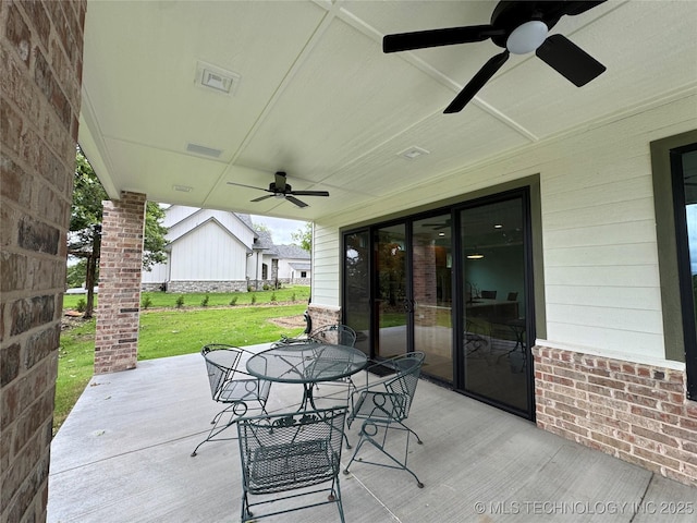 659 Sleepy Hollow Ln, Cleveland, OK 74020 - deck featuring a ceiling fan, outdoor dining space, a lawn, and a patio