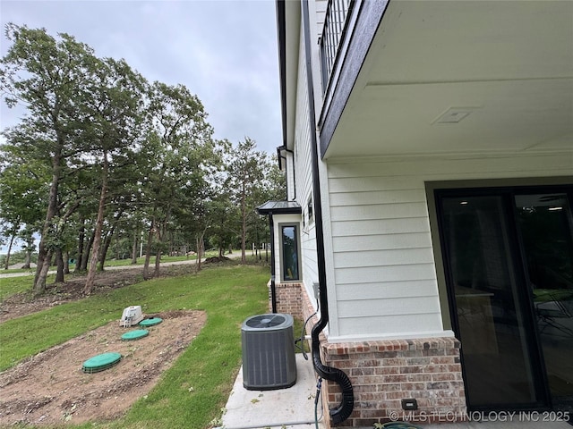 659 Sleepy Hollow Ln, Cleveland, OK 74020 - exterior view of cooling unit and brick siding