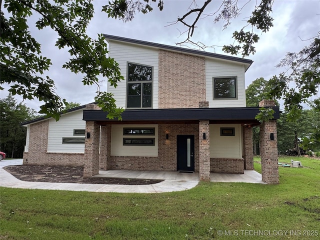 659 Sleepy Hollow Ln, Cleveland, OK 74020 - contemporary home with a front lawn and brick siding