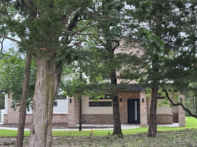 659 Sleepy Hollow Ln, Cleveland, OK 74020 - obstructed view of property with brick siding
