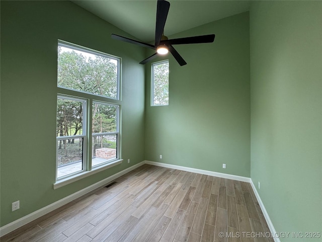 659 Sleepy Hollow Ln, Cleveland, OK 74020 - empty room with wood finished floors, ceiling fan, and baseboards