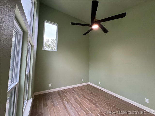 659 Sleepy Hollow Ln, Cleveland, OK 74020 - empty room with plenty of natural light, wood finished floors, ceiling fan, and baseboards