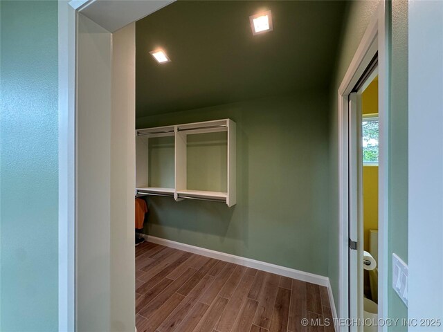 659 Sleepy Hollow Ln, Cleveland, OK 74020 - walk in closet with wood finished floors