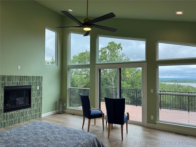 659 Sleepy Hollow Ln, Cleveland, OK 74020 - bedroom with wood finished floors, access to outside, baseboards, and a fireplace