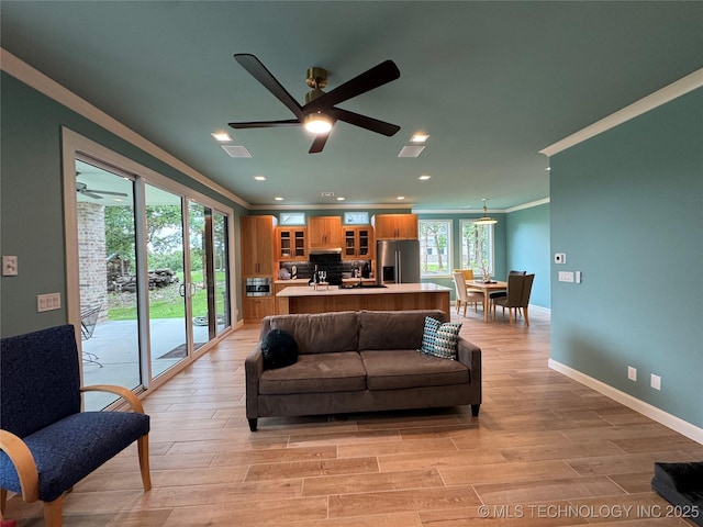 659 Sleepy Hollow Ln, Cleveland, OK 74020 - living area featuring crown molding, recessed lighting, light wood-style floors, baseboards, and ceiling fan