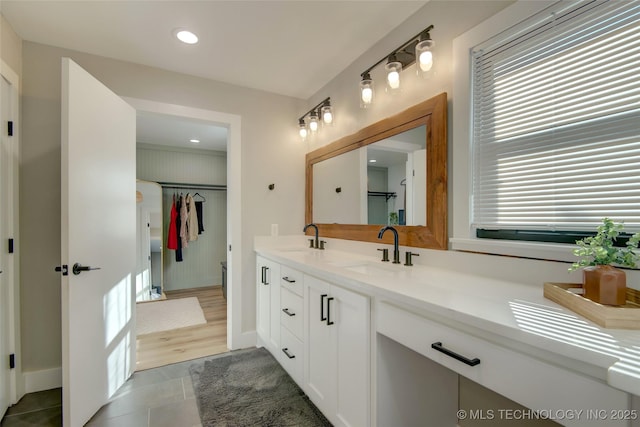5132 S Atlanta Ave, Tulsa, OK 74105 - bathroom with double vanity, tile patterned floors, baseboards, and recessed lighting