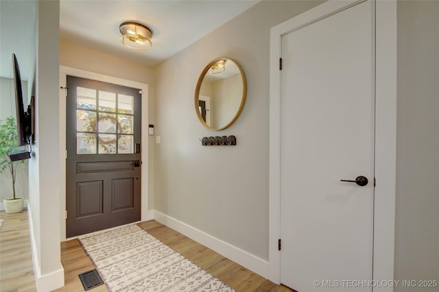 5132 S Atlanta Ave, Tulsa, OK 74105 - foyer entrance with baseboards and light wood finished floors